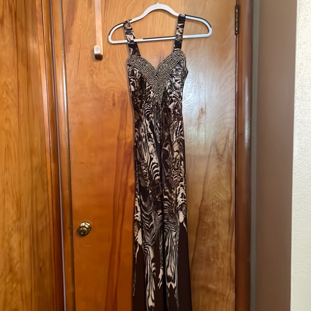 Brown leopard print. Worn once. 47 from under arm to floor.